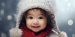 Cute little asian baby in winter cap and scarf. Banner with snowy background. Shallow depth of field.