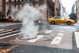 Fototapeta  - Steamy street scene with yellow taxi in New York