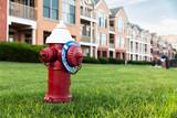 Fototapeta  - Red fire hydrant in suburban neighborhood in New Jersey