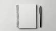 Blank open notebook with a sleek pen on a clean white background