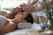 © Katie/peopleimages.com - Sleep, head massage and couple relax in spa for care of body with rest on table of retreat for honeymoon. Hotel, man and woman together in resort for health, wellness and luxury for skincare