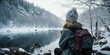 Woman with backpack admiring snowy lake view, suitable for travel blogs