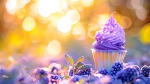  a cupcake with purple frosting sitting in a field of blueberries and raspberries on a sunny day.