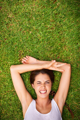 Canvas Print - Woman, portrait and top view on grass for relax with funny face, peace sign and weekend break in summer. Young person, happy and confident on lawn, garden or backyard of home for fresh air on mockup