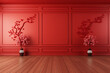 An interior scene in Chinese style featuring a cherry blossom branch in a vase against a red paneled wall.