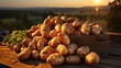 Rustic sack overflowing with potatoes on a wooden table against a hilly,