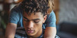 Pensive Young Man with Curly Hair Looking Downward