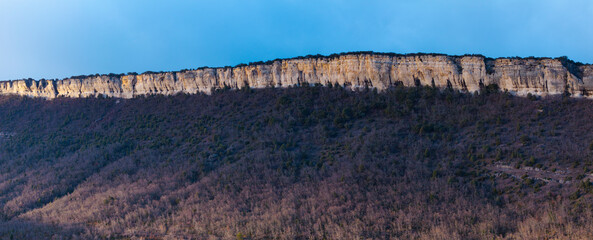 Wall Mural - Landscape of cliffs and forest around the town of Puentedey in the Merindad de Valdeporres. Aerial view from a drone. The Merindades region. Burgos. Castile and Leon. Spain. Europe