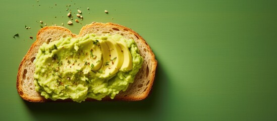 Wall Mural - Freshly Baked Bread Slice Covered with Vibrant Green Pesto Spread