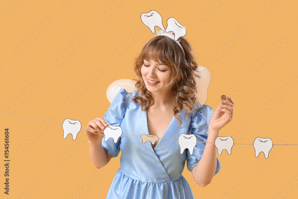 Tooth Fairy with coin and paper teeth on yellow background