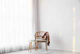 Fototapeta Dmuchawce - Interior of room with light curtain, armchair and table