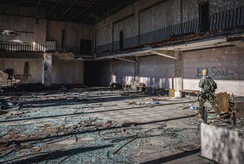 Poster - Tourist in Energetik Palace of Culture in Pripyat ghost city in Chernobyl Exclusion Zone, Ukraine