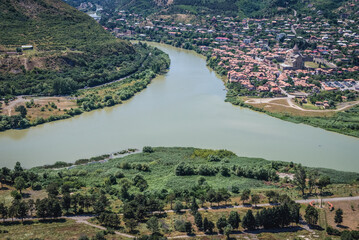 Wall Mural - Aerial view from Orthodox Jvari Monastery on Jvari Mount on Mtskheta historic town over Aragvi and Kura rivers, Georgia