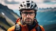 Man wearing helmet and glasses stands confidently before towering mountain backdrop ready for adventure and exploration. He may be gearing up for bicycle ride or some other outdoor activity.