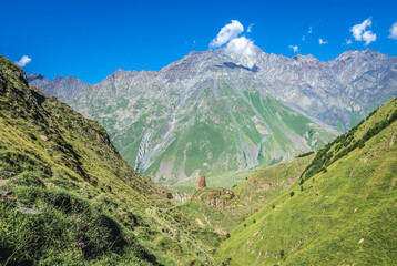 Wall Mural - Mount Shani senn from path from Stepantsminda town and Gergeti village to Gergeti Holy Trinity Church in Caucasus Mountains, Georgia