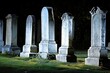 Series of marble gravestones in a row, illuminated by a gentle morning light.