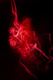 Fototapeta Tęcza - Red smoke motion on black background.
