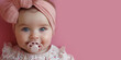 Little cute asian girl with pacifier. Banner with red background and copy space. Shallow depth of field.