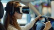© morepiixel - A young woman wearing virtual reality glasses learns driving in a driving school. Girl in VR glasses controls a virtual machine using the steering wheel.