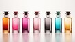 A set of square glass perfume bottles with different colors, arranged in a row on a white background