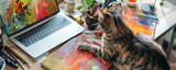 Fototapeta Uliczki - Cat Contemplating Artistic Chaos on Desk A curious cat surveys the vibrant mess of an artist's workspace, with a paint-splattered canvas and scattered art supplies framing a laptop screen.

