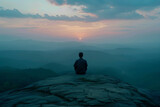 Fototapeta  - Person meditating on a mountain peak at sunrise, tranquil nature landscape, ideal for backgrounds with space for text
