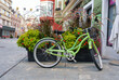 Slovenia, Celje. Green bicycle on the street of the old town.