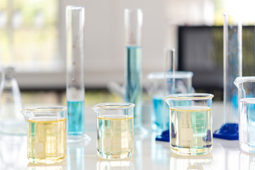 Wall Mural - close up pipette dropping a sample into a test tube for research tool anatomy of small organisms wit