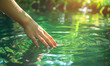 A hand touching the surface of pure green water of the river in nature on a sunny day, Generative AI