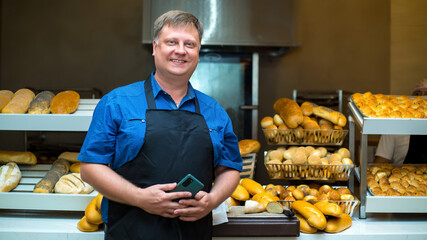 Wall Mural - businessman from Europe opened his own bakery business selling bread.