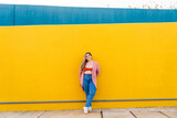 Fototapeta Miasto - Beautiful plus size young woman outdoors - Confident chubby oversize female model strolling in the city, concepts about diversity, body acceptance and body positive