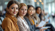 Team of professional business women or group of staff sitting on the chairs in a row. Female job candidates seekers with resumes in hand interview invitation turn.