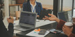 © Sirikarn Rinruesee - Business team meeting working with new startup project, discussion and analysis data the charts and graphs. Digital tablet, calculator, laptop computer using, Business finance and accounting concept.