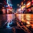 Neon lights reflecting on a wet pavement. 