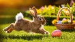 A fluffy brown rabbit is running in a field of green grass, leaving behind two colorful Easter eggs. A basket of eggs is placed in the grass nearby.