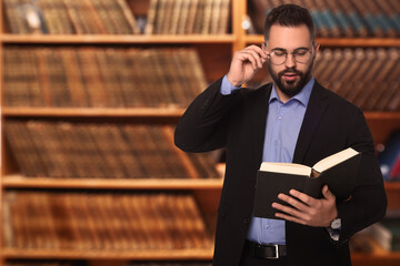 Poster - Confident lawyer in glasses reading book in office, space for text