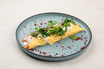 Wall Mural - Portion of gourmet rolled omelette with salmon