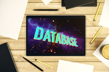 Wall Mural - top view of modern digital tablet monitor with database word sign, global research and analytics con