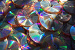 Stack of glossy and reflective CDs in a book
