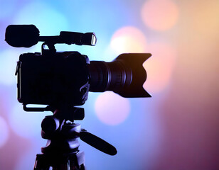 Silhouette of a professional studio video camera. Preparation and release of news.