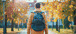 © Oleksandr - Back to school, Back of college student with backpack while going to university by walking from street, teenager in campus, education background