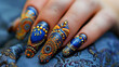 Design an abstract Mehendi pattern on a hand adorned with striking blue nail art.