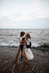 Wall Mural - Husband gently holds his wife's neck and is about to kiss her