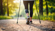Close up of person of retirement age engaged in Nordic walking in the park, healthy lifestyle