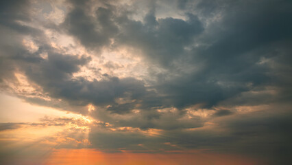 Wall Mural - Idyllic sunset sky with clouds and rays as beautiful natural background