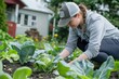 A woman plants cabbage. Weeding the garden. Plant care. growing vegetables. planting seedlings, gardening, weeding,