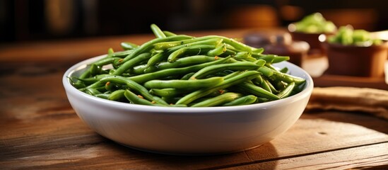 Sticker - A dish of green beans, a staple food in many cuisines, is placed on a wooden table. These legumes, part of the vegetable family, are a natural produce and nutritious ingredient