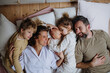 © Halfpoint - Top view of family lying in bed with kids and newborn baby. Perfect moment. Strong family, bonding and parents' unconditional love for their children.