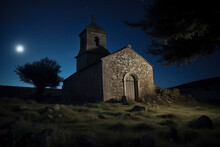 A Small Stone Church Under A Starry Night Sky, Illuminated By Moonlight, Surrounded By Rocky Terrain And A Solitary Tree. It Evokes A Sense Of Solitude And Reflection