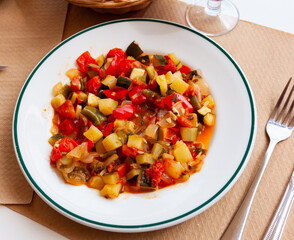 Wall Mural - Platter of stewed vegetables - bell pepper, zucchini and parsley